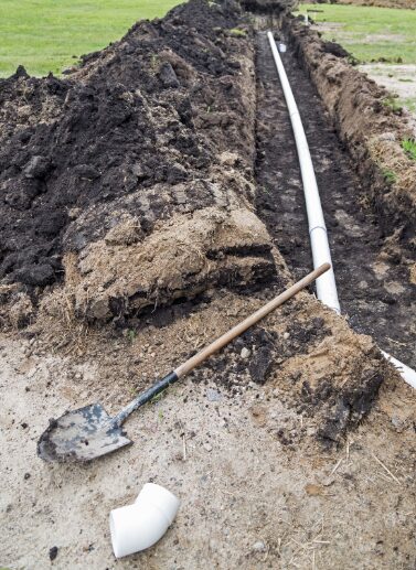 Drain field pipe repair work in an open trench